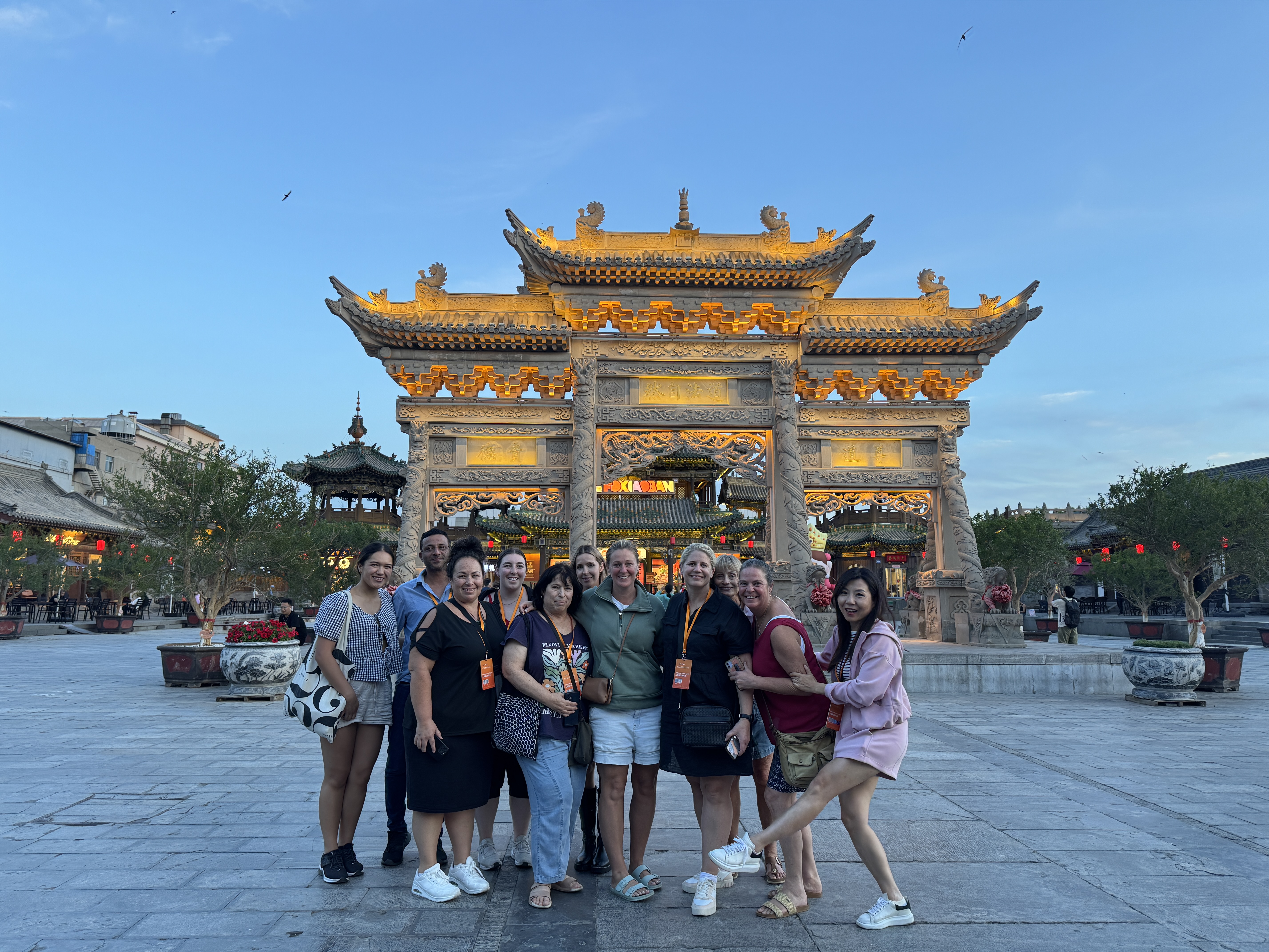 CTS group at Xi'an's illuminated ancient city gate at dusk